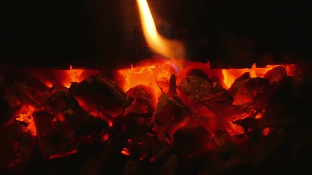 Soft orange flames from burning birch logs in indoor fireplace in slow motion hd. Burning logs with soft warm orange beautiful relaxing flames.