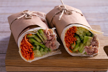 Tuna wraps. Wraps with tuna fish, cucumber, avocado and carrot. Homemade tasty burrito