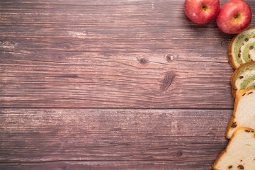 red bean and raisin bread with red apple composition backgrounds on wooden table food and drink concept with copy space