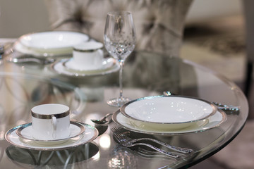 Plates and glasses on the table. Luxurious serving