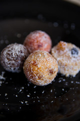 Sweets without sugar with dried fruits, sprinkled with coconut chips