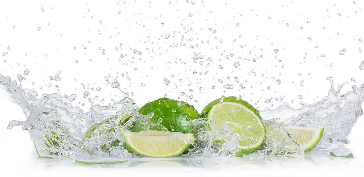Fresh limes with water splash