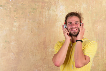 Cheerful dj listening songs via earphones.