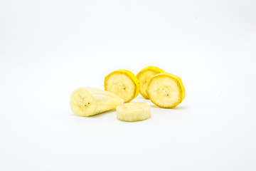 Slices of a banana on a white background