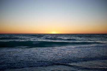 Fototapeta na wymiar Tropical sunset over Florida beach and ocean