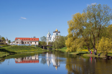 Fototapeta na wymiar View from the river to the Trinity Cathedral in Pskov, Russia