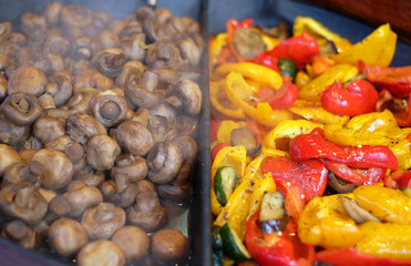 Sweet pepper and mushrooms on the grill in close up. Roasted vegetables