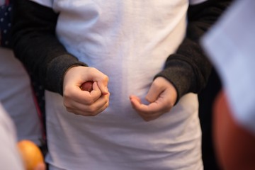 kid holding easter egg in hand