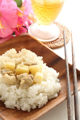 Thai food, chicken and new potato green curry on rice