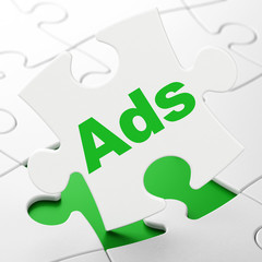 Marketing concept: Ads on White puzzle pieces background, 3D rendering