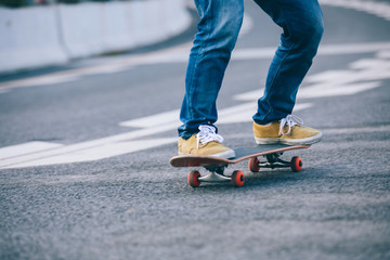Fototapeta na wymiar Skateboarder sakteboarding on city street
