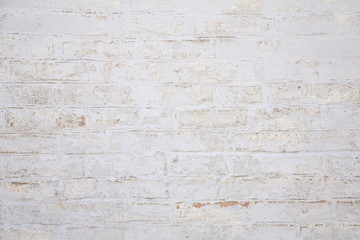 Old scratched white brick wall. Texture. 
