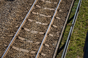 Railway tracks during sunny day, high angle view