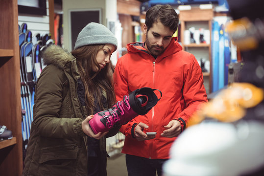 Couple selecting shoe in a shop