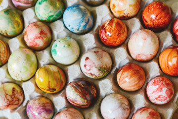 Colorful easter eggs in paper tray