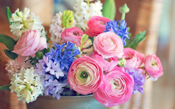 Beautiful bouquet of spring flowers in a vase on the table. Lovely bunch of flowers . 