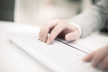 Image of man's hands typing. Selective focus.