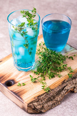 Ice Blue cocktail with thyme. Blue curacao liqueur. Summer