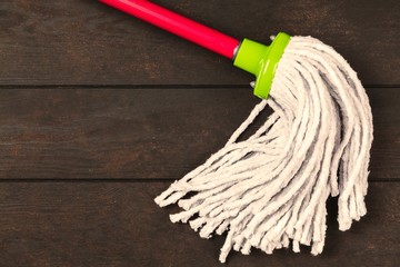 Cleaning supplies on wooden background