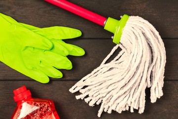 Cleaning supplies on wooden background