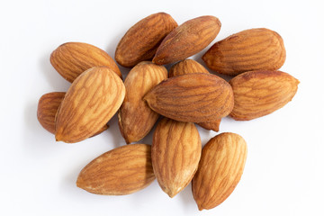 A pile of almonds on white background. with copy space for your text.