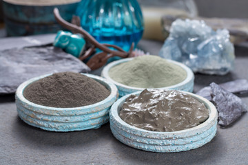 Ancient nature minerals, different types of clay used for skincare, spa treatments, face masks, gray, black, green and blue mud, close up