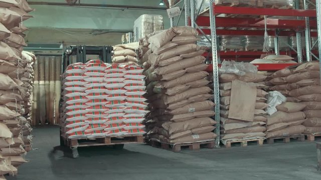 Loaders moves boxes on industrial warehouse