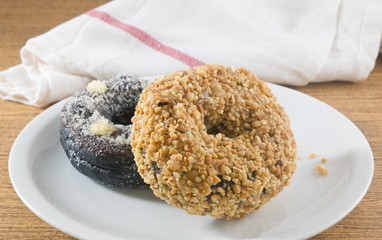 Dish of Fresh Chocolate Donut and Peanuts Donut