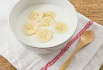 Bowl of Homemade Yoghurt with Ripe Banana