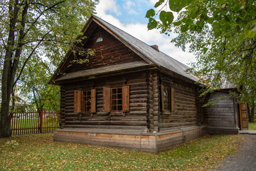 Old well maintained log wooden house in the village