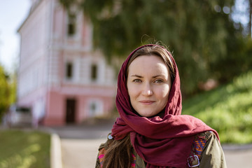 Bright fresh portrait of a young woman on the street in the spring day, no photoshop