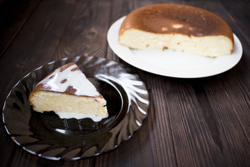 Cottage cheese cake on black plate.