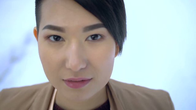 Korean girl looking into the camera close-up1-1