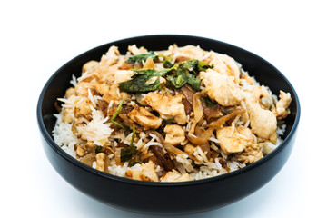 Homemade Chinese fried rice with vegetables and fried eggs