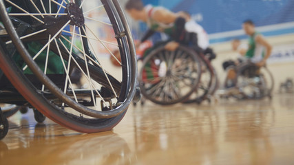 Handicapped basketball player in a wheelchair during sportive training