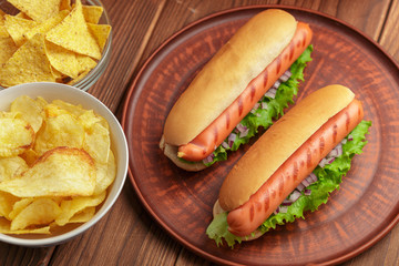 Hot dogs on wooden background