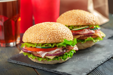 Fast food, homemade burger on a wooden background