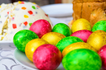 Fototapeta na wymiar Bright colorful painted eggs on the table for Easter
