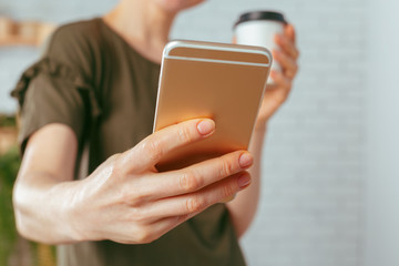 close up of woman texting on smartphone
