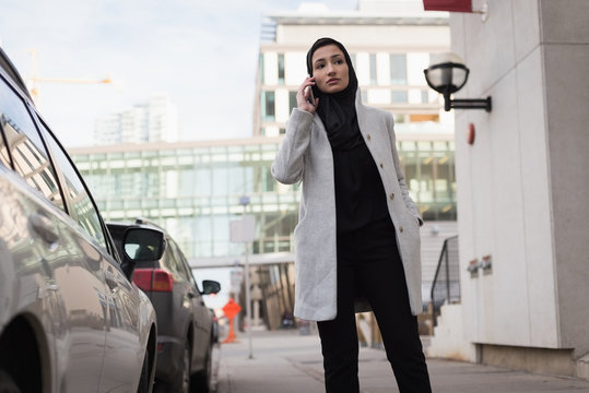 Woman in hijab talking on mobile phone