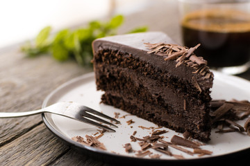 chocolate cake on wood background.