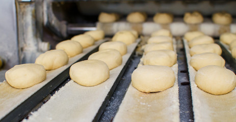 Preparing dough in a bakery.