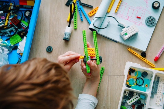 child building robot at robotic technology school lesson