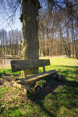 Weathered and wooden bench in the rural German countryside in spring