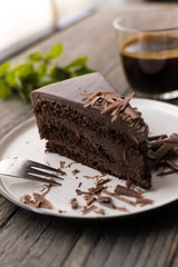 chocolate cake on wood background.