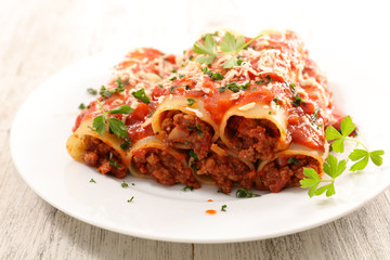 canneloni with beef and tomato sauce