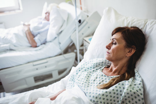 Female Patient Sleeping On A Bed