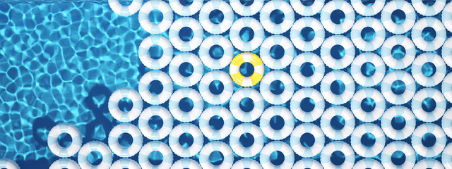 unique yellow float ring between blue float rings in pool. 3d rendering
