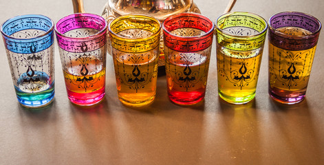 arabic teapot with colorful glasses