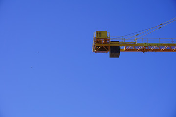 Yellow construction crane isolated 